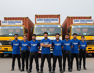 Shree Ramsharnam Logistics team standing confidently in front of branded cargo trucks, symbolizing proven experience and reliability.
